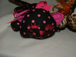 black and pink cat
